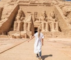 A traveler walks towards the Great Temple of Ramesses II at Abu Simbel, a must see on any 10 Days Egypt Itinerary.