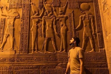 A Traveler Looking At Ancient Hieroglyphs During An 11 Day Classic Egypt Tour: Cairo, Nile Cruise And Abu Simbel.