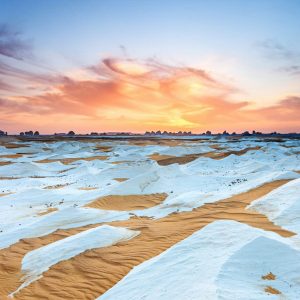 Farafra Oasis is a serene desert oasis in Egypt known for its white desert landscape, picturesque palm groves, and natural hot springs.