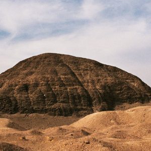 The Hawara Pyramid, built by Pharaoh Amenemhat III, is an ancient Egyptian structure known for its labyrinthine interior layout.