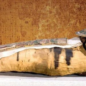 Ancient mummification process involving meticulous preservation of the body through embalming and wrapping techniques.