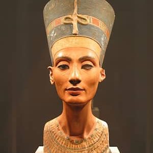 Nefertiti, renowned Egyptian queen, known for her beauty; played a key role in the religious revolution, promoting Aten worship.