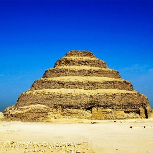 The Saqqara Step Pyramid, an ancient marvel in Egypt, represents the world's earliest large-scale cut stone construction and symbolizes powerful Egyptian innovation.