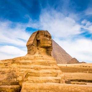 The Sphinx, an iconic limestone statue in Egypt, features a lion's body and a human head, symbolizing strength and wisdom.