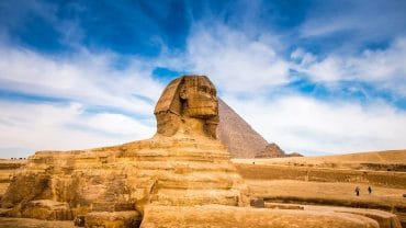 The Sphinx, an iconic limestone statue in Egypt, features a lion's body and a human head, symbolizing strength and wisdom.