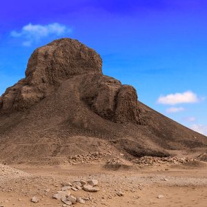 The Black Pyramid in Egypt, constructed during the reign of King Amenemhat III, is an ancient mudbrick structure covered in dark stone.