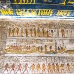Detailed and brightly colored hieroglyphs and religious scenes cover the walls of an Ancient Burial Chambers for Pharaohs with Hieroglyphics at the Valley of the Kings Luxor, showcasing the artistry of ancient Egyptian tombs.