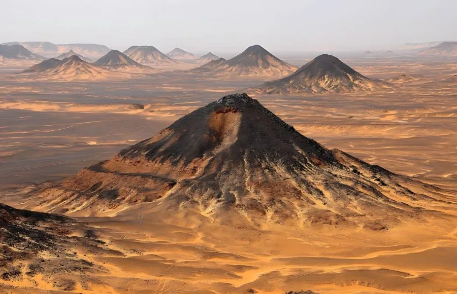 Panoramic view of the volcanic black hills in the Black Desert near Bahariya Oasis.
