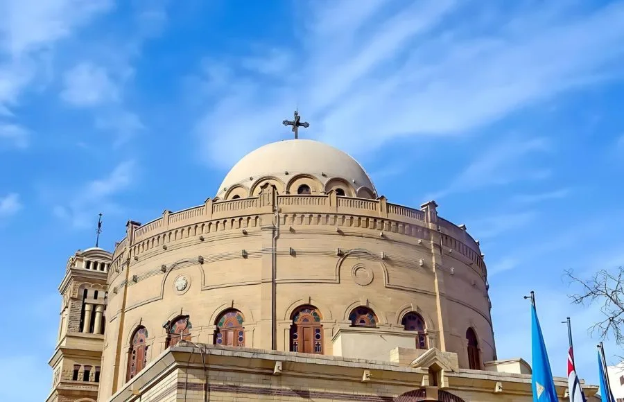 Close-up view of the distinctive dome and cross of the Church of St. George in Old Cairo.