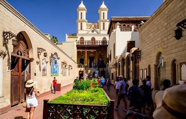 Tourists at the entrance courtyard of the historic Hanging Church in Coptic Cairo.