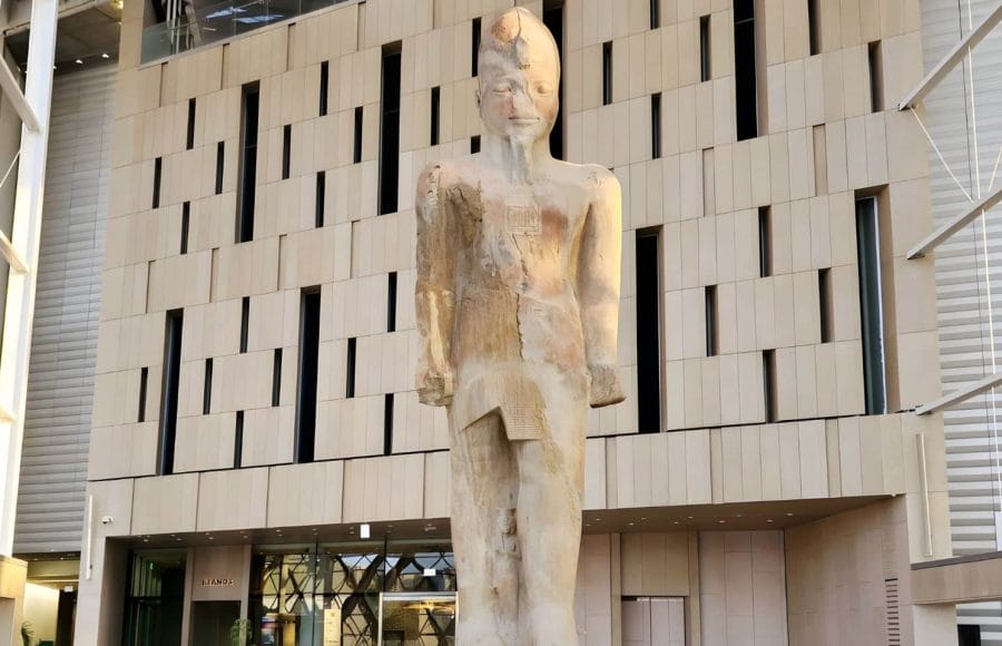 The colossal statue of Ramses II stands tall in the Grand Egyptian Museum.