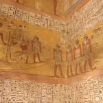Detailed and colorful Hieroglyphics Inside the Tomb of Rameses VI, Valley of the Kings, depicting scenes and figures from ancient Egyptian mythology.