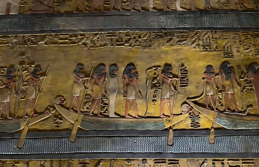Intricate and well-preserved Reliefs and Paintings in the Tomb of Pharaoh Sety I in the Valley of the Kings, showing richly colored figures and hieroglyphics, including a procession of figures on barques.
