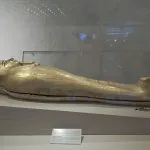 The highly decorated, shining Gold Coffin of Nedjemankh on display at a museum dedicated to Egyptian Civilization in Cairo, Egypt.