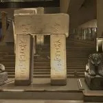 Massive ancient Egyptian statues and artifacts on display in the brightly lit, modern entrance hall during The Grand Egyptian Museum Tour.