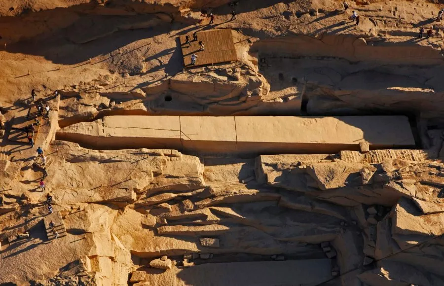 A group of people standing on Unfinished Obelisk Aswan