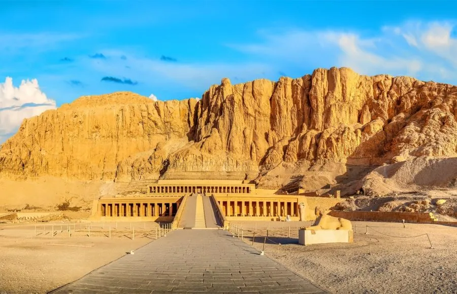 A stone walkway leading to a temple of Queen Hatshepsut