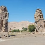 The two colossal, seated statues of Pharaoh Amenhotep III, known as the Colossi of Memnon.