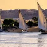 Two traditional Egyptian sailing boats (feluccas) in Aswan.