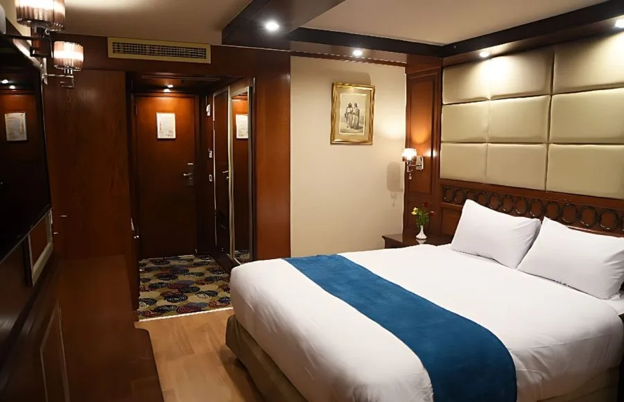 A clean and modern cabin with two single beds on the Blue Shadow II Nile cruise.