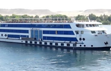 The exterior of the MS Blue Shadow ii Nile Cruise ship sailing on the Nile River.