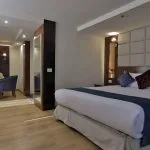 A luxurious suite on the Blue Shadow II Nile cruise with a separate sitting area.