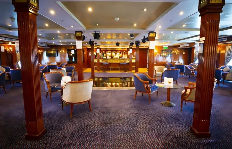 The main lounge on the Blue Shadow iii Nile Cruise features comfortable seating and a central area for entertainment.