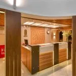 The welcoming reception area of the HS Solaris I Nile Cruise, featuring a stylish desk, warm lighting, and elegant wood paneling.