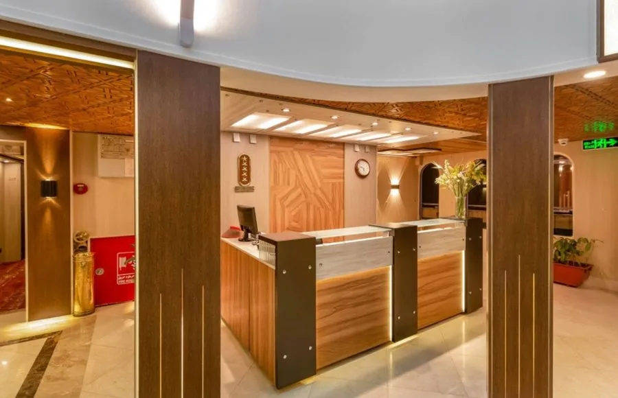 The welcoming reception area of the HS Solaris I Nile Cruise, featuring a stylish desk, warm lighting, and elegant wood paneling.