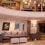 The welcoming reception area of the MS Al Jamila Nile Cruise ship, featuring comfortable seating and a warm atmosphere