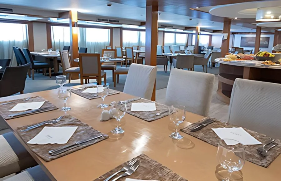 A beautifully set table awaits diners in the spacious restaurant of the Sabena Al Jamila Nile Cruise