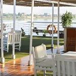 Enjoy the stunning views from the sun deck of the MS Al Jamila Nile Cruise, featuring a swimming pool and lounge chairs