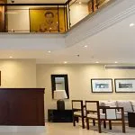 The inviting reception area of the Al Kahila Nile cruise with a wooden desk and modern furnishings, greeting guests.