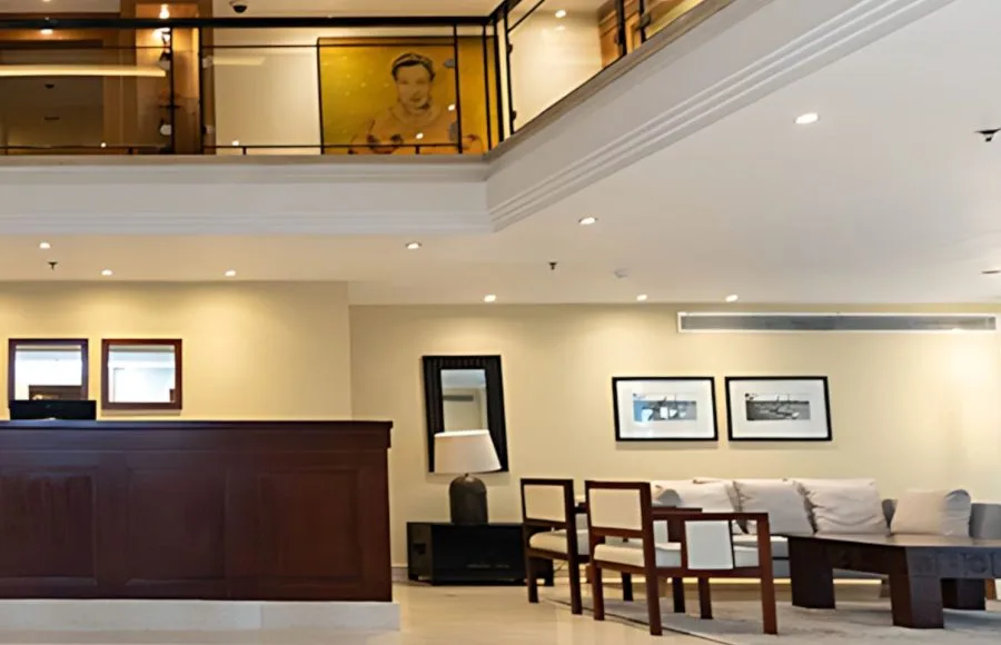 The inviting reception area of the Al Kahila Nile cruise with a wooden desk and modern furnishings, greeting guests.