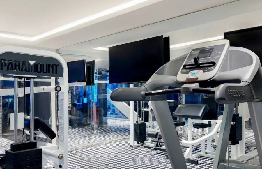 The modern onboard gymnasium of the Movenpick MS Darakum Nile Cruise features cardiovascular and strength training equipment including a treadmill and weight machine for guest use
