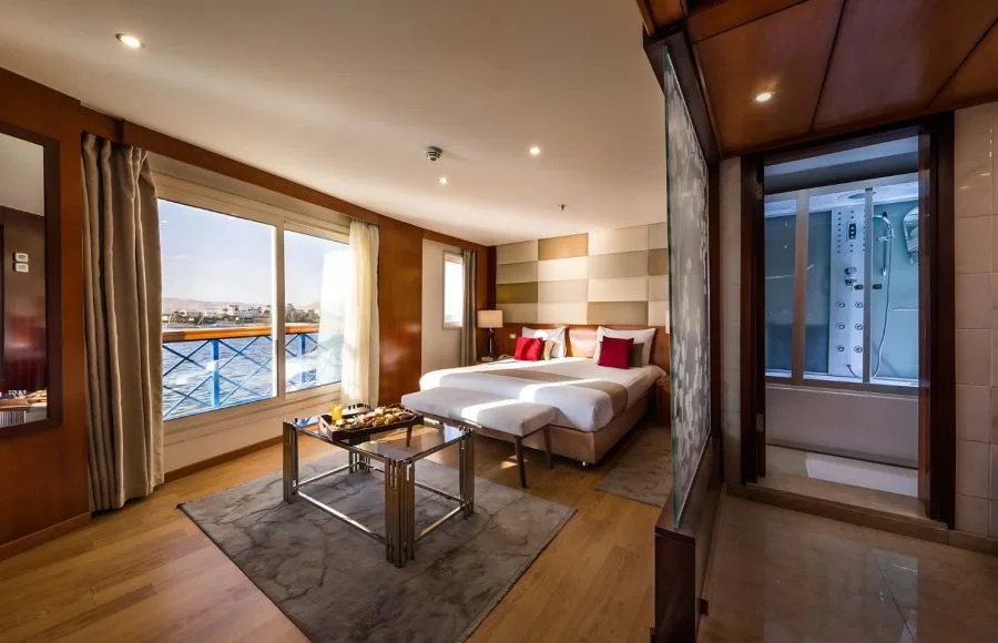 Luxury cabin with balcony and shower cabin on a Nile cruise ship.