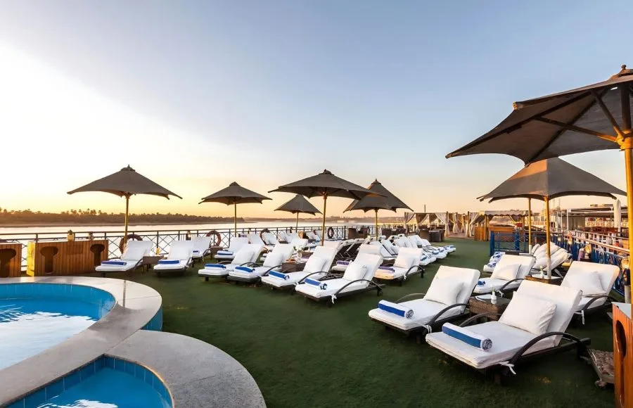 Rows of sun loungers and umbrellas on the Esmeralda Nile cruise ship deck.
