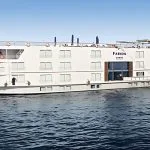 The elegant MS Farida Nile Cruise sails on the serene Nile River, a stunning view of the boat that promises a luxurious and memorable journey.