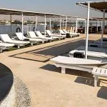 Relax by the sparkling pool on the spacious sun deck of the MS Farida Nile Cruise, offering comfortable loungers and refreshing shade for ultimate enjoyment.