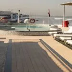 Ms Farida Nile cruise sun deck with a sparkling pool and luxurious loungers, offering stunning views along the Nile.
