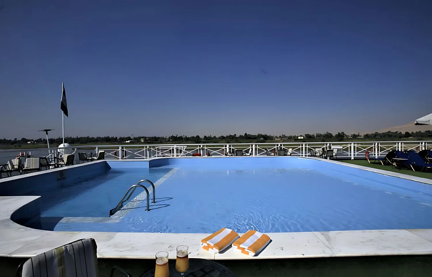 Swimming pool on the sundeck of the Iberotel Crown Emperor ship.
