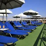 Sun deck with blue loungers on the Iberotel Crown Emperor Nile Cruise.
