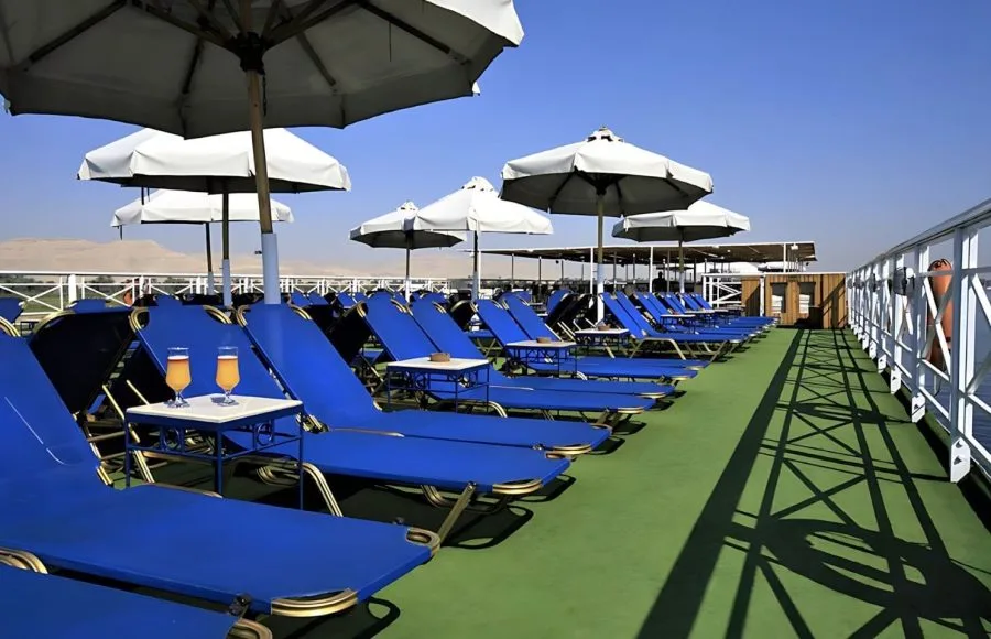 Sun deck with blue loungers on the Iberotel Crown Emperor Nile Cruise.