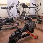 Gymnasium with exercise equipment on the Crown Empress Cruise.