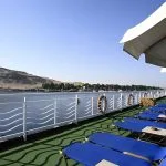 Sun deck with loungers and umbrellas on the MS Iberotel Crown Empress Nile Cruise.