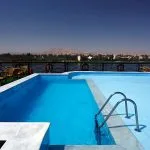 MS Jaz Crown Jewel poolside view with the Nile River and desert hills in the background