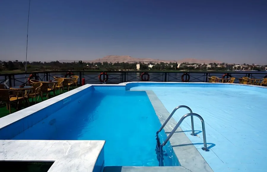 MS Jaz Crown Jewel poolside view with the Nile River and desert hills in the background