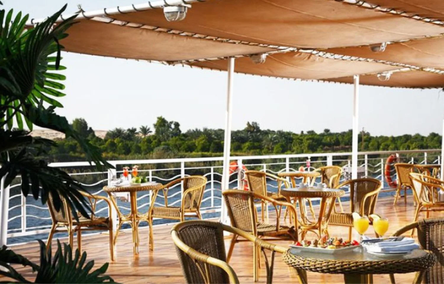 The sundeck of the Ms Crown Jubilee Nile Cruise with a covered seating area.
