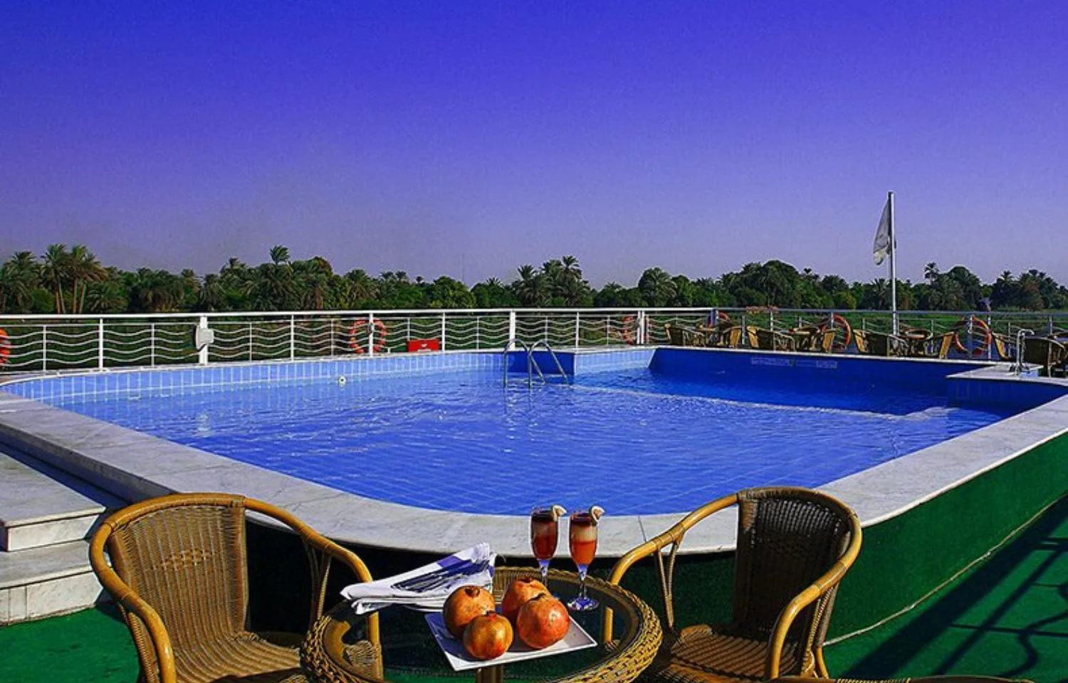 The sundeck pool with a scenic view on the Jaz Crown Jubilee Nile Cruise.