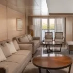 The elegant reception area of the MS Jaz Regent Nile Cruise, featuring comfortable seating, modern décor, and large windows with views of the Nile.